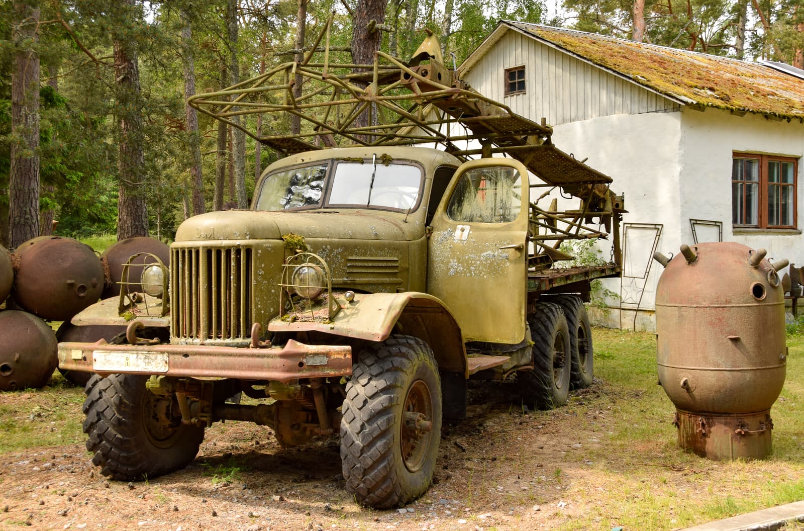 An old Soviet ZiL military truck and empty mine casings outside the museum on Naissaar