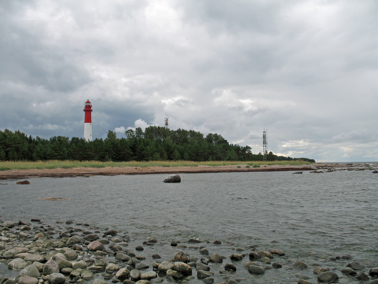 The red-and-white Naissaar lighthouse rising above the forest on the island’s stony north coast